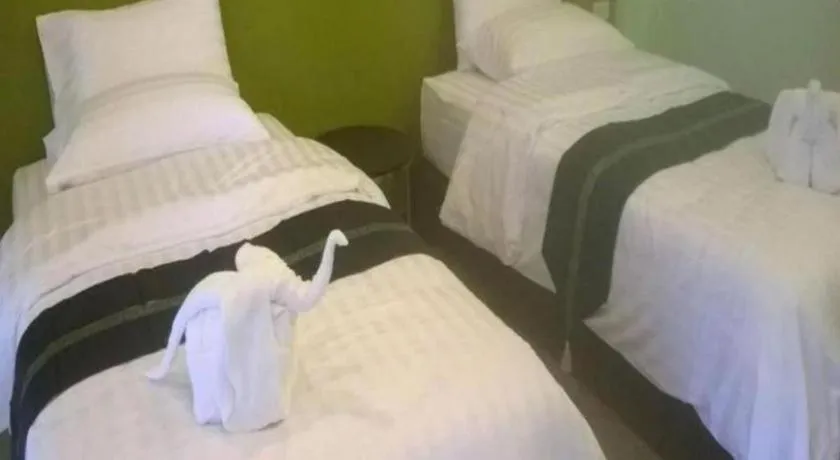 Bed in Sawasdee River Kwai Lodge