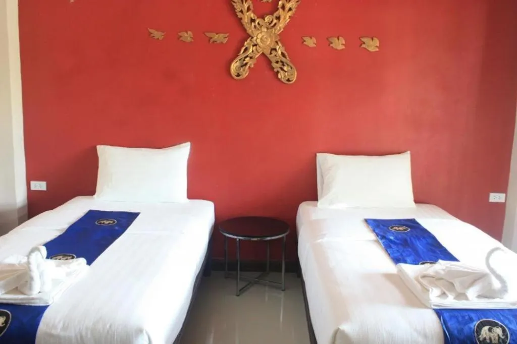 Bed in Sawasdee River Kwai Lodge