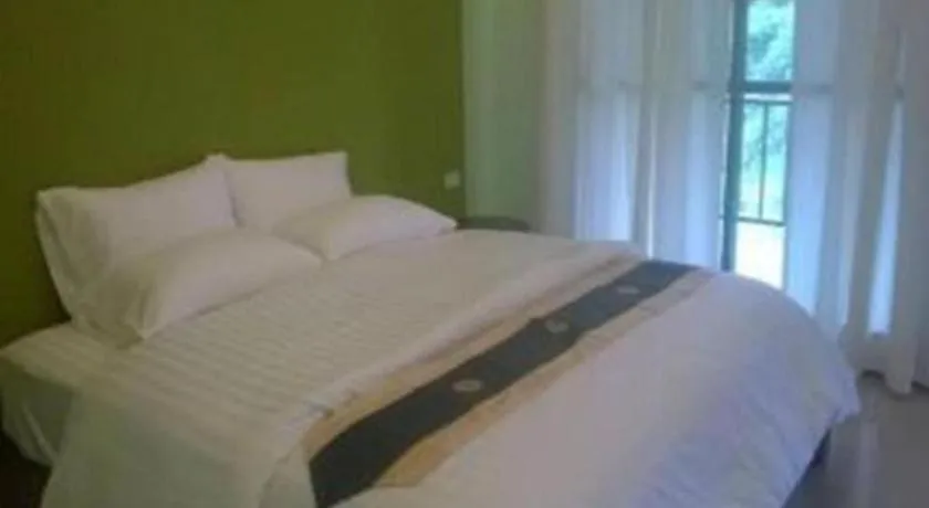 Bed in Sawasdee River Kwai Lodge