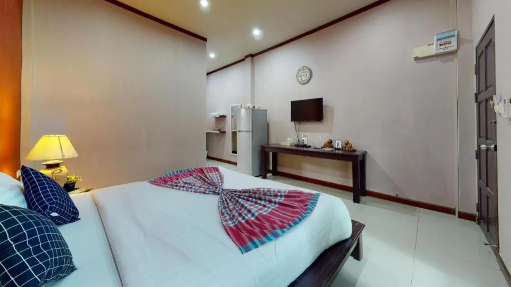 Bed in Sawasdee River Kwai Lodge