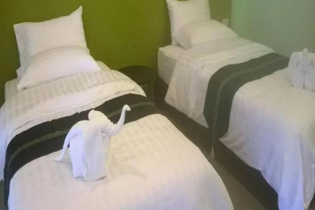 Bed in Sawasdee River Kwai Lodge