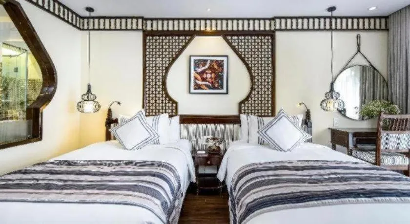 Bed in Le Pavillon Hoi An Paradise Hotel & Spa