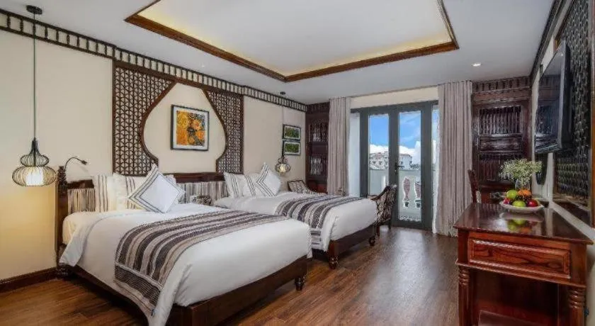 Bed in Le Pavillon Hoi An Paradise Hotel & Spa