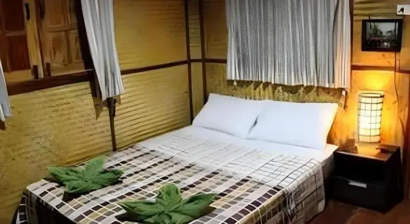 Bed in Green Cottage Beach Resort Bed in Green Cottage Beach Resort