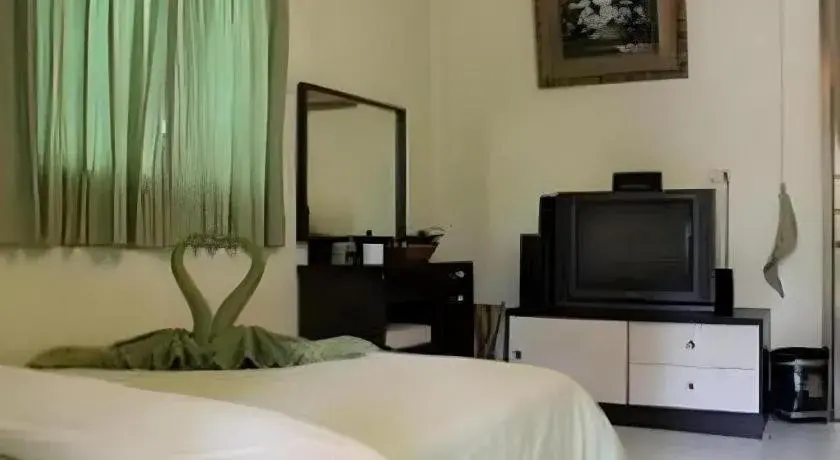 Bed in Green Cottage Beach Resort Bed in Green Cottage Beach Resort