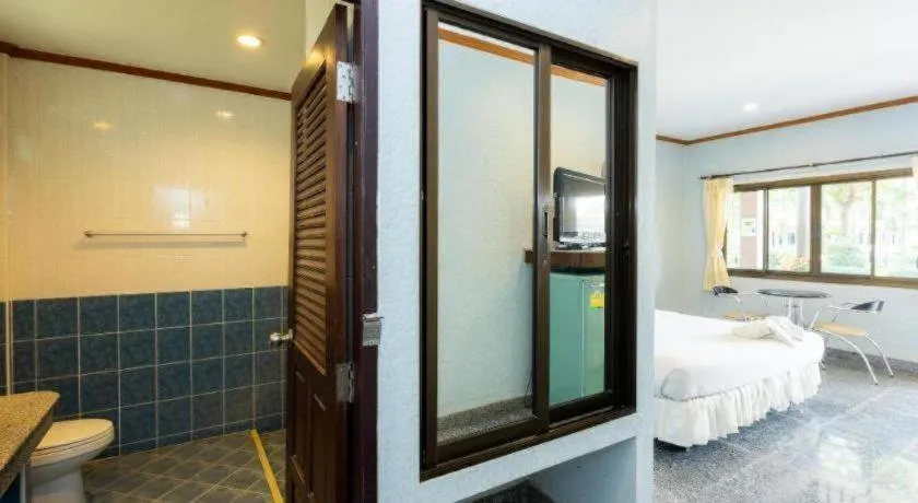 Bed in Manee Sangkha Hotel