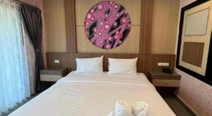 Bed in Manee Sangkha Hotel