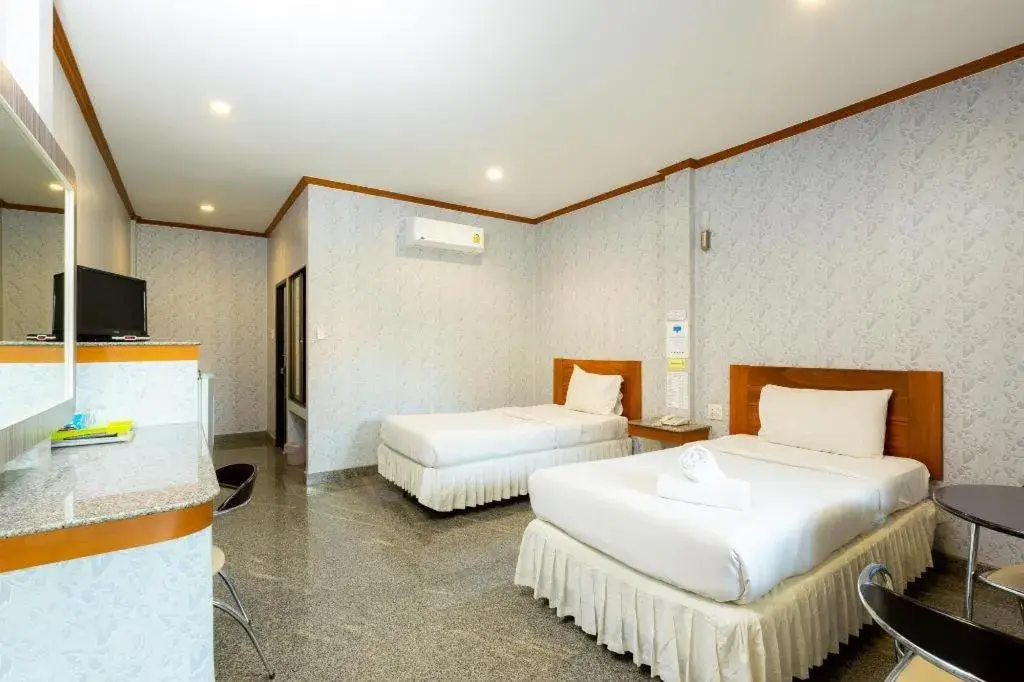 Bed in Manee Sangkha Hotel Bed in Manee Sangkha Hotel