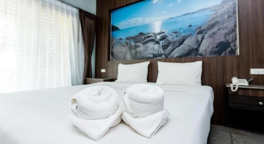 Bed in Manee Sangkha Hotel