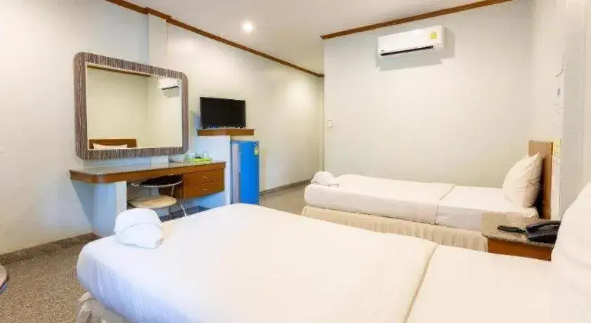 Bed in Manee Sangkha Hotel Bed in Manee Sangkha Hotel