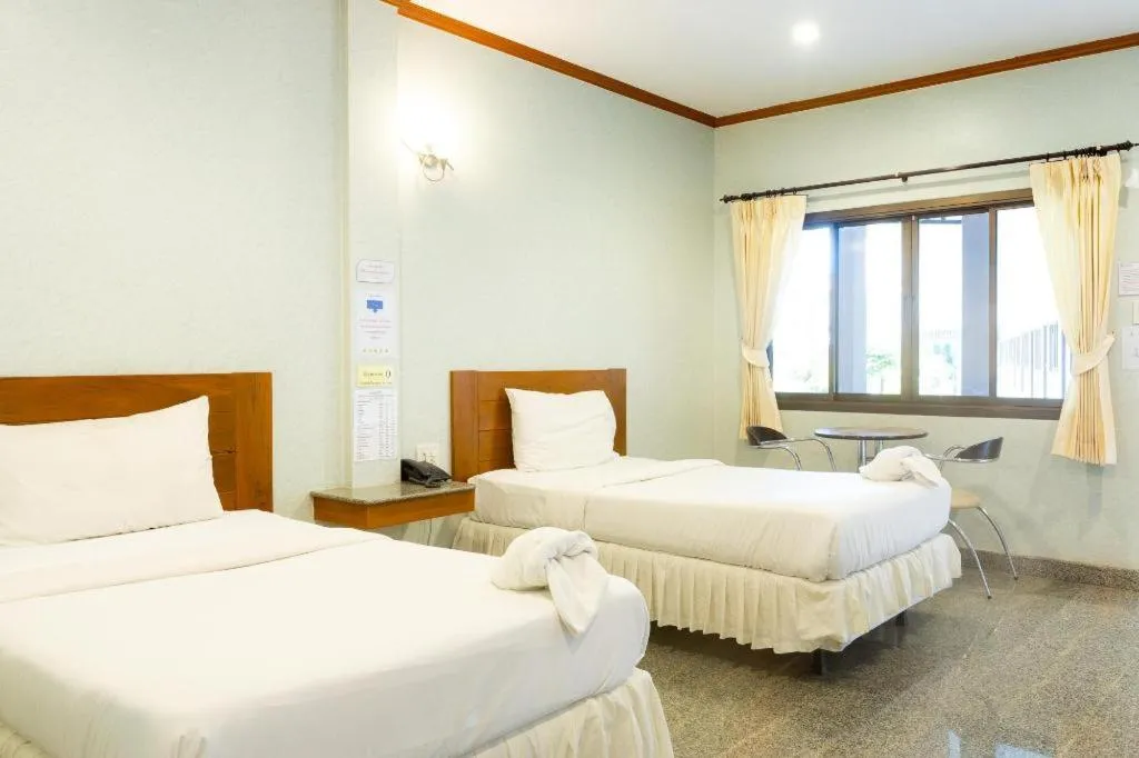 Bed in Manee Sangkha Hotel