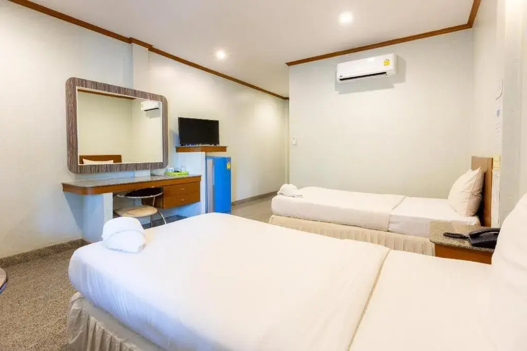 Bed in Manee Sangkha Hotel Bed in Manee Sangkha Hotel