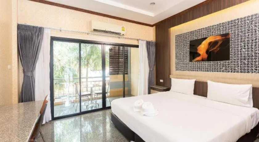 Bed in Manee Sangkha Hotel