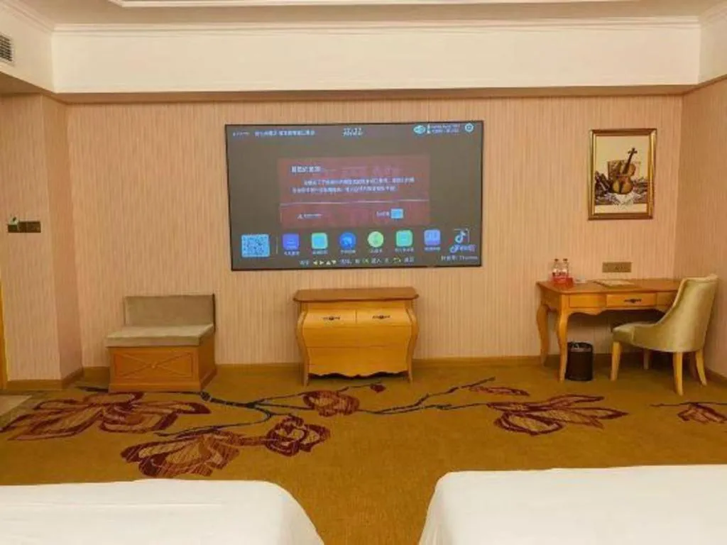 Bed in Vienna Hotel Guangdong Xinyi Jiaoyucheng River View