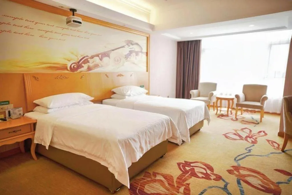 Bed in Vienna Hotel Guangdong Xinyi Jiaoyucheng River View