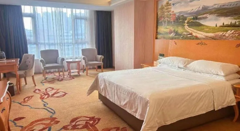 Bed in Vienna Hotel Guangdong Xinyi Jiaoyucheng River View