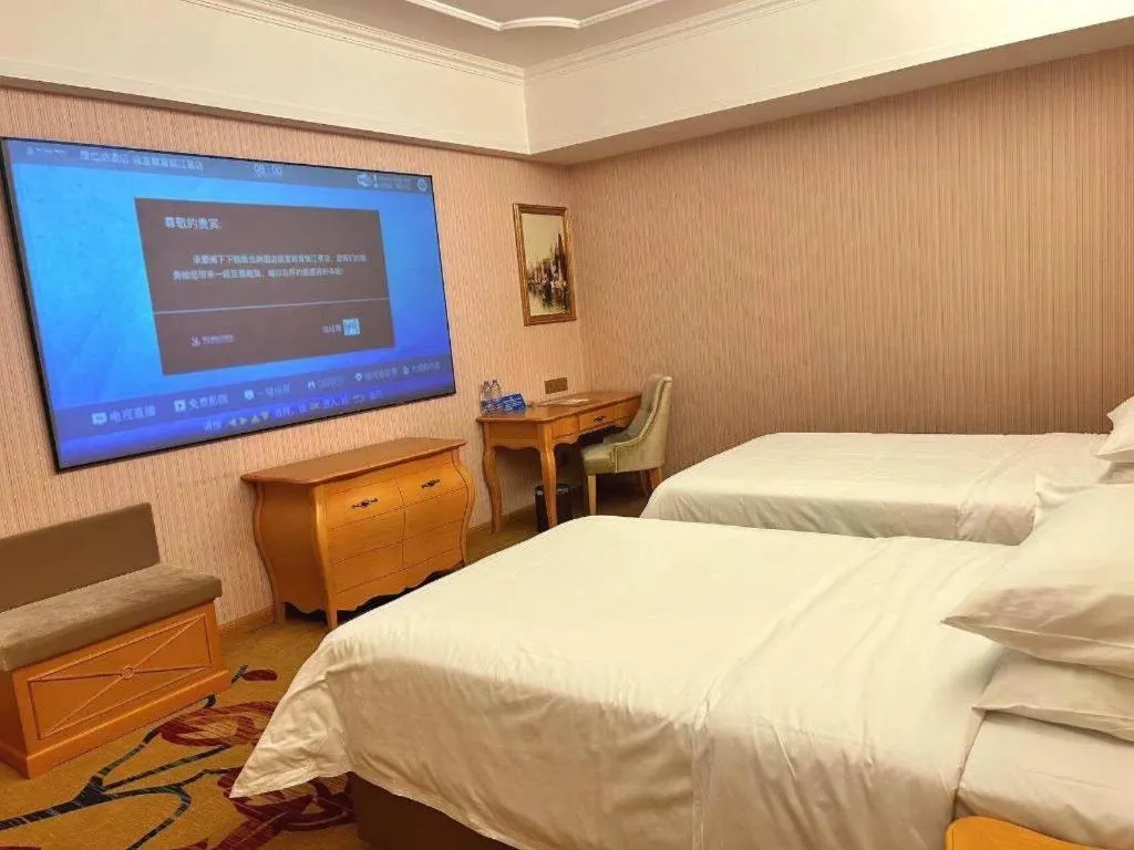 Bed in Vienna Hotel Guangdong Xinyi Jiaoyucheng River View