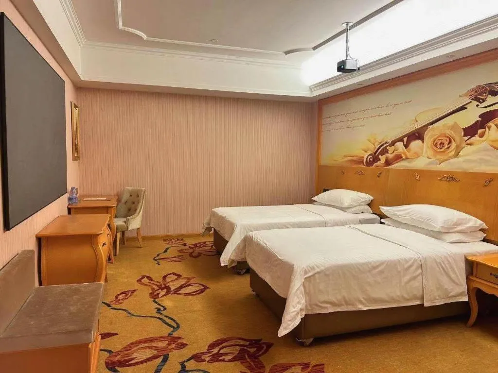 Bed in Vienna Hotel Guangdong Xinyi Jiaoyucheng River View