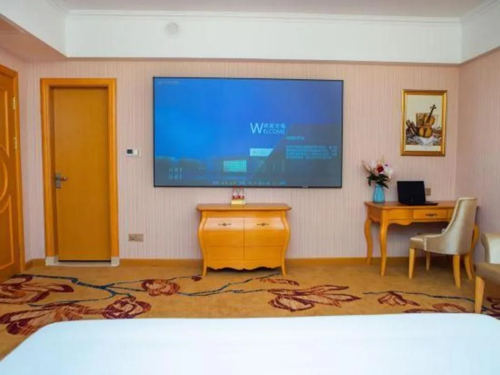 Bed in Vienna Hotel Guangdong Xinyi Jiaoyucheng River View