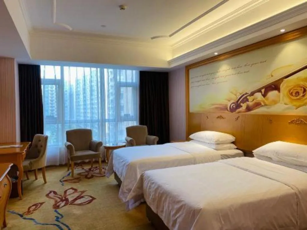 Bed in Vienna Hotel Guangdong Xinyi Jiaoyucheng River View