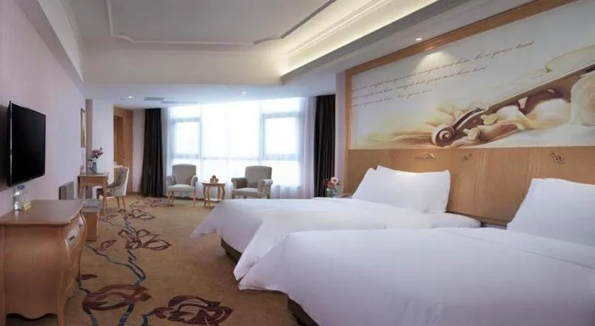 Bed in Vienna Hotel Guangdong Xinyi Jiaoyucheng River View
