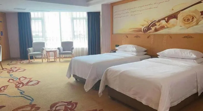 Bed in Vienna Hotel Guangdong Xinyi Jiaoyucheng River View