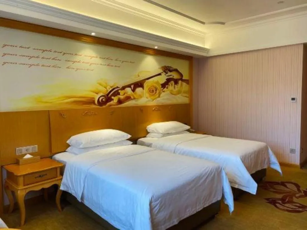 Bed in Vienna Hotel Guangdong Xinyi Jiaoyucheng River View