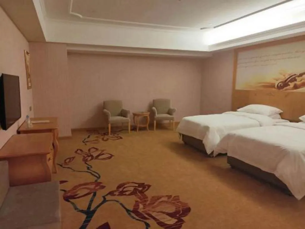 Bed in Vienna Hotel Guangdong Xinyi Jiaoyucheng River View