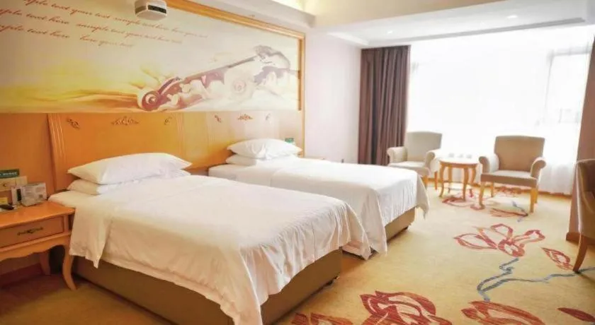 Bed in Vienna Hotel Guangdong Xinyi Jiaoyucheng River View