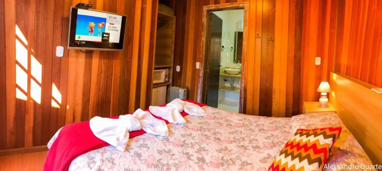 Bed in Pousada Recanto Ninho Verde Chalés