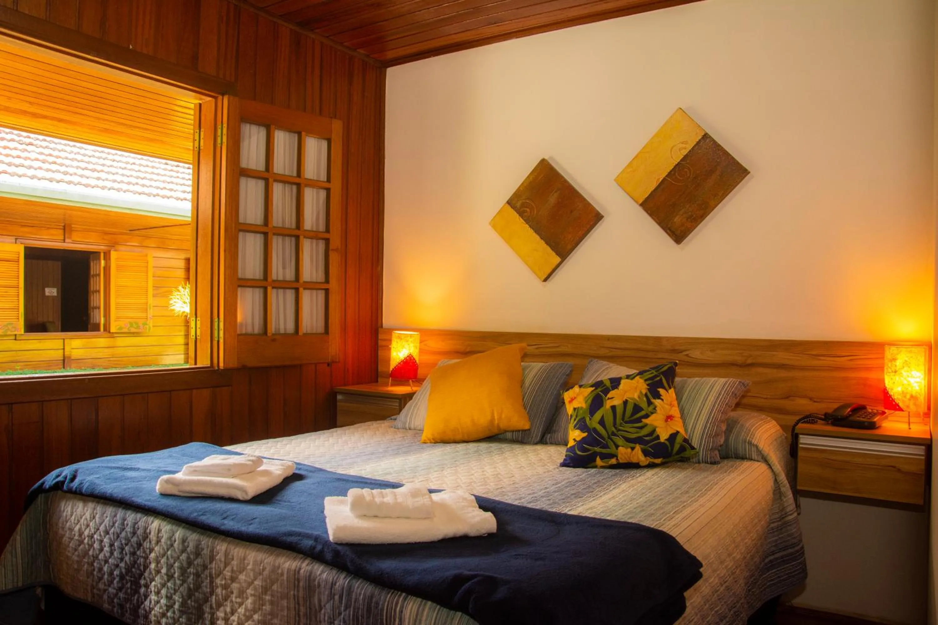 Bed in Pousada Recanto Ninho Verde Chalés