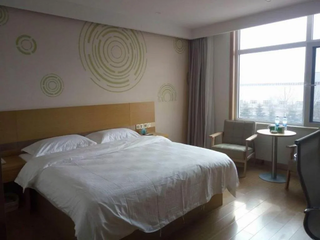 Bed in GreenTree Inn Qingdao Jiaozhou Jiaoping Road Express Hotel