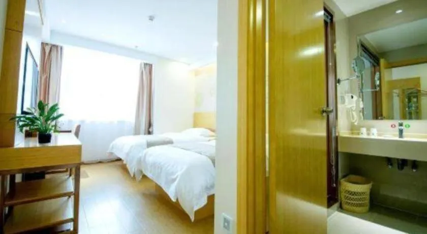Bed in GreenTree Inn Zhangjiagang Yangshe Old Street Stadium