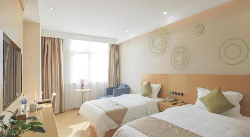 Bed in GreenTree Inn Zhangjiagang Yangshe Old Street Stadium