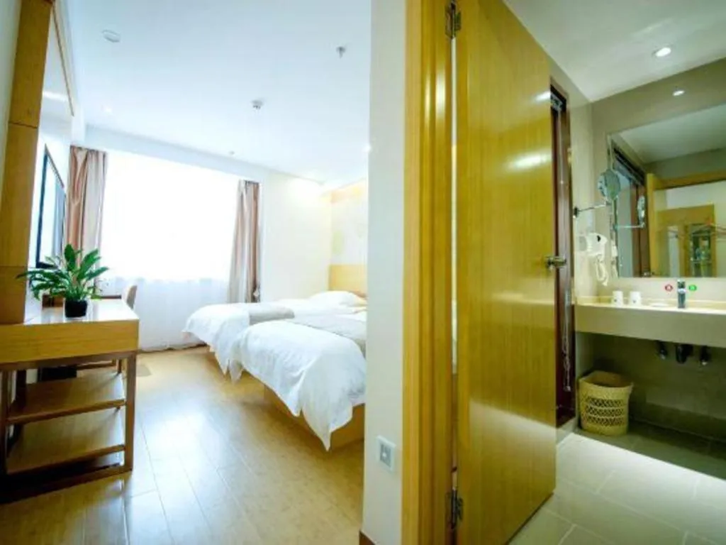 Bed in GreenTree Inn Zhangjiagang Yangshe Old Street Stadium