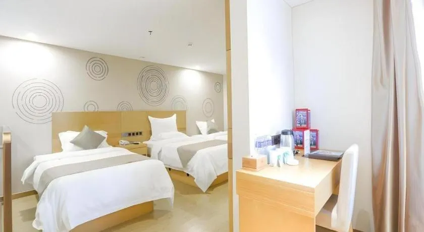 Bed in GreenTree Inn Zhangjiagang Yangshe Old Street Stadium