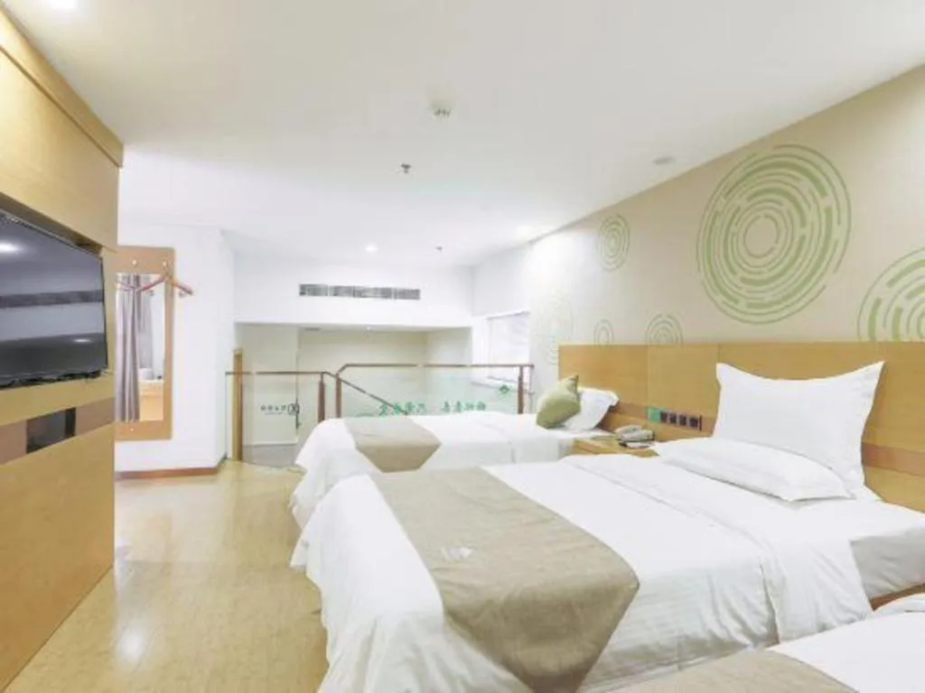 Bed in GreenTree Inn Zhangjiagang Yangshe Old Street Stadium