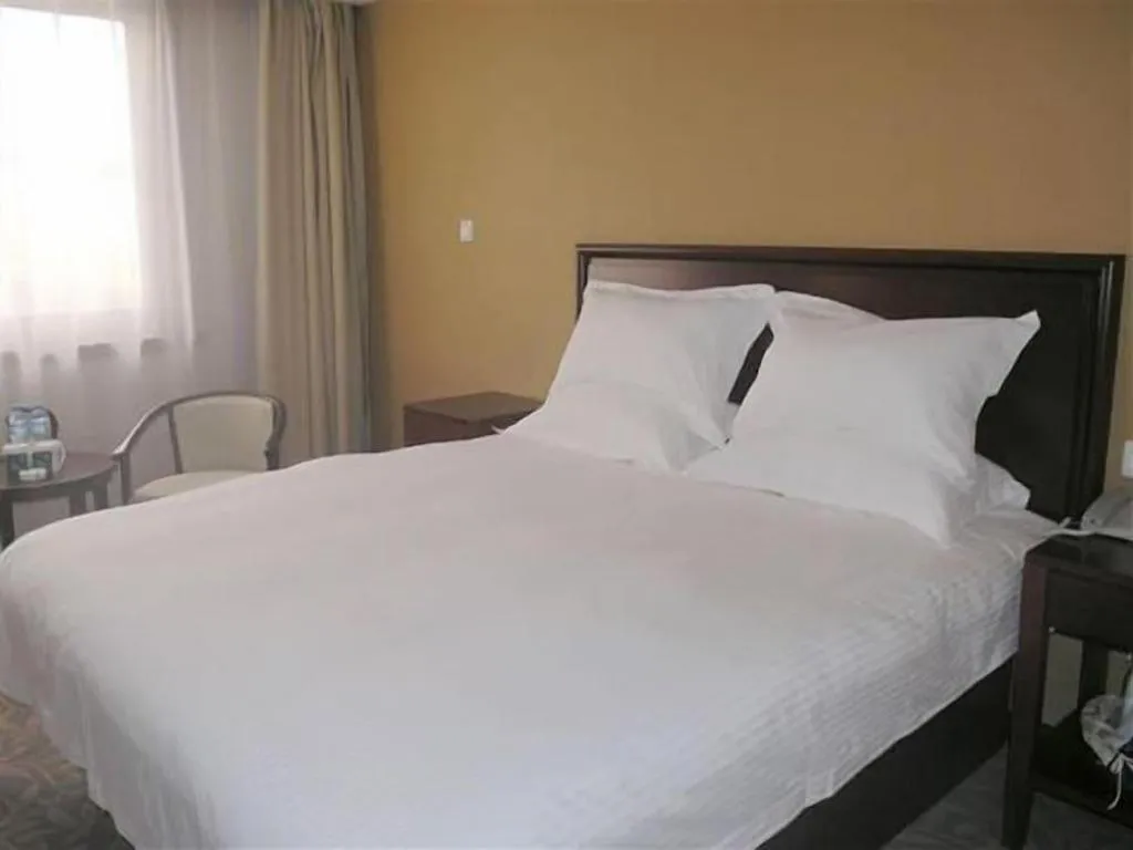 Bed in GreenTree Inn Zhangjiagang Yangshe Old Street Stadium