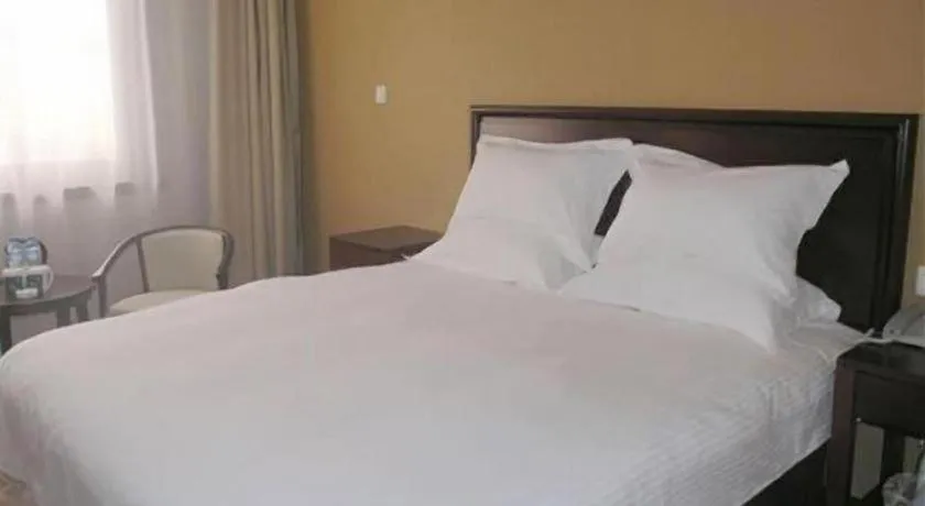 Bed in GreenTree Inn Zhangjiagang Yangshe Old Street Stadium