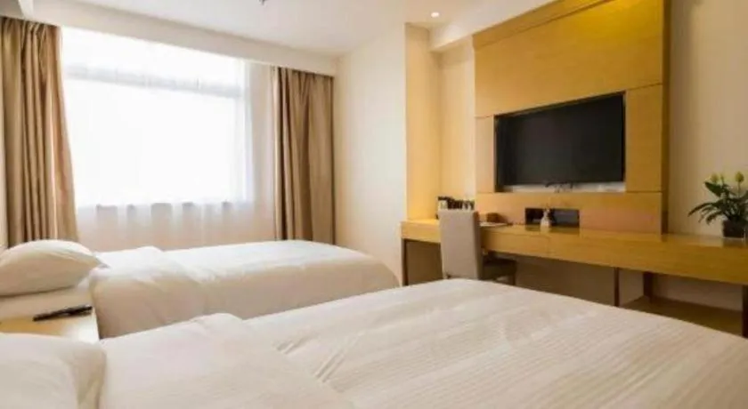 Bed in GreenTree Inn Zhangjiagang Yangshe Old Street Stadium