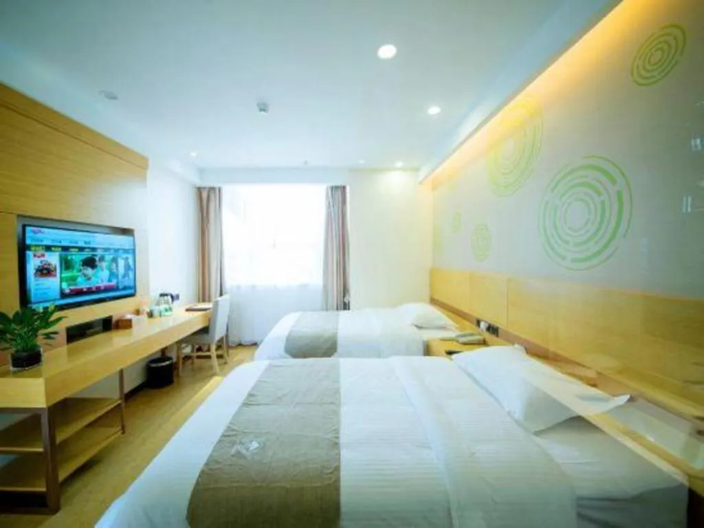 Bed in GreenTree Inn Zhangjiagang Yangshe Old Street Stadium