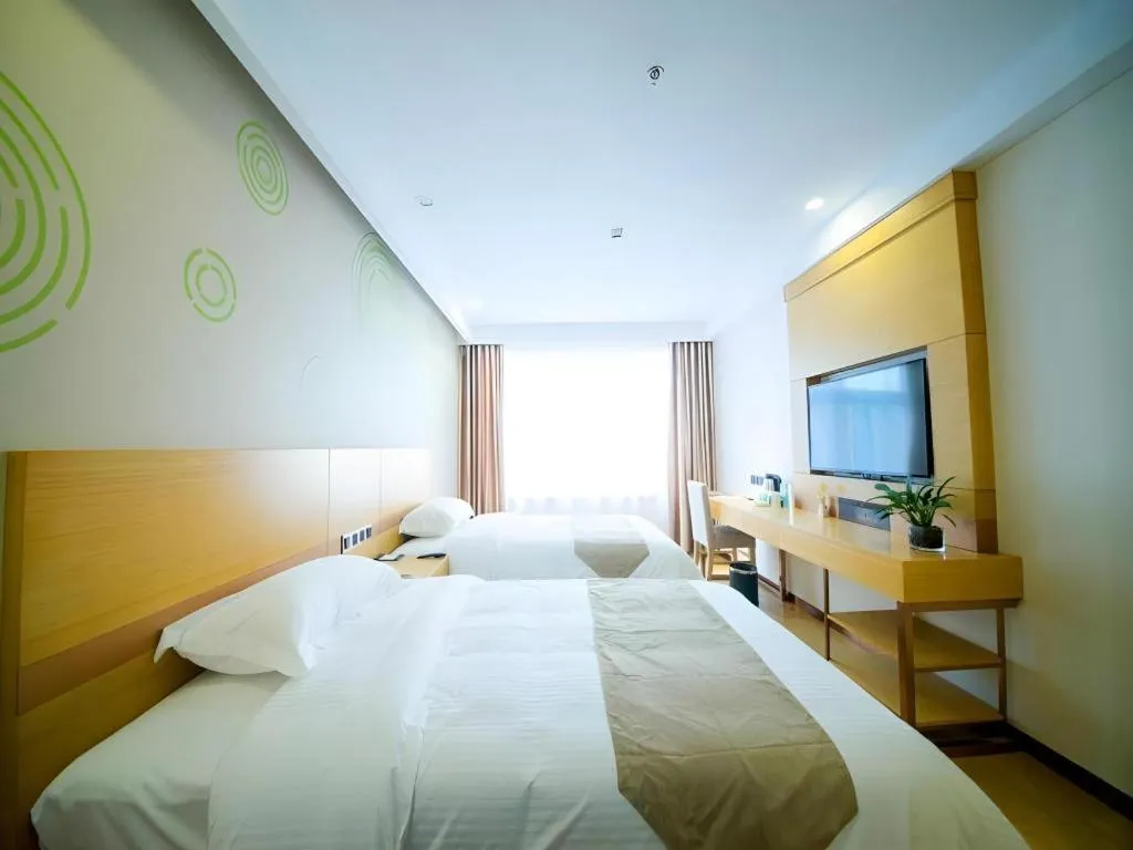 Bed in GreenTree Inn Zhangjiagang Yangshe Old Street Stadium