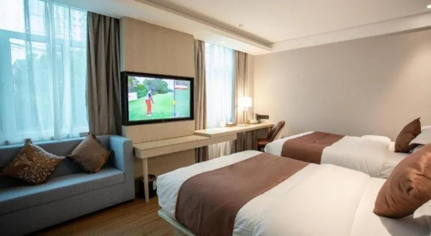 Bed in GYA Shanghai Jiangpu Hotel