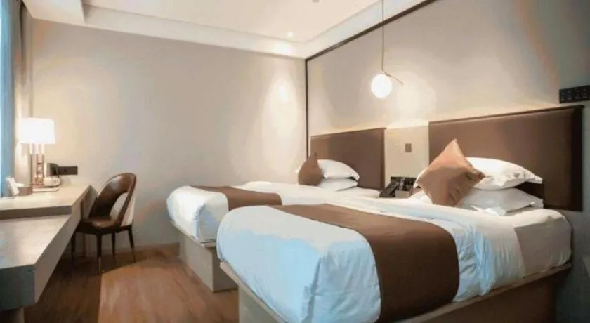 Bed in GYA Shanghai Jiangpu Hotel