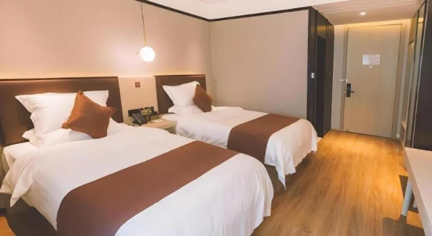 Bed in GYA Shanghai Jiangpu Hotel