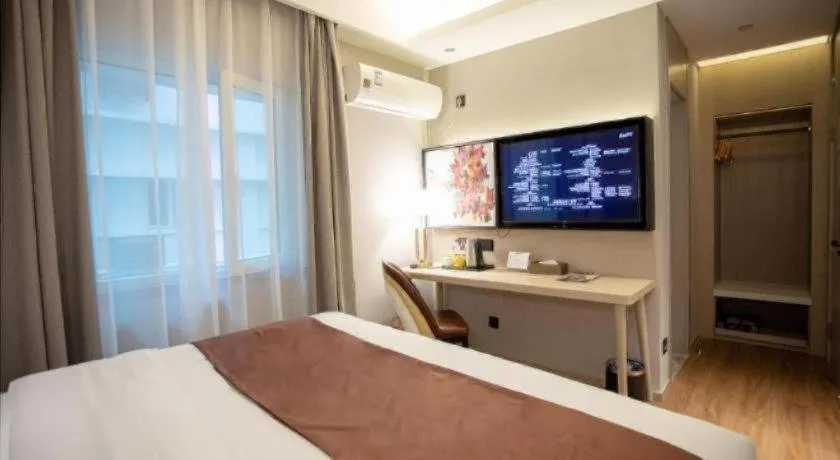 Bed in GYA Shanghai Jiangpu Hotel