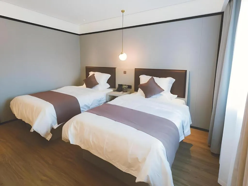 Bed in GYA Shanghai Jiangpu Hotel