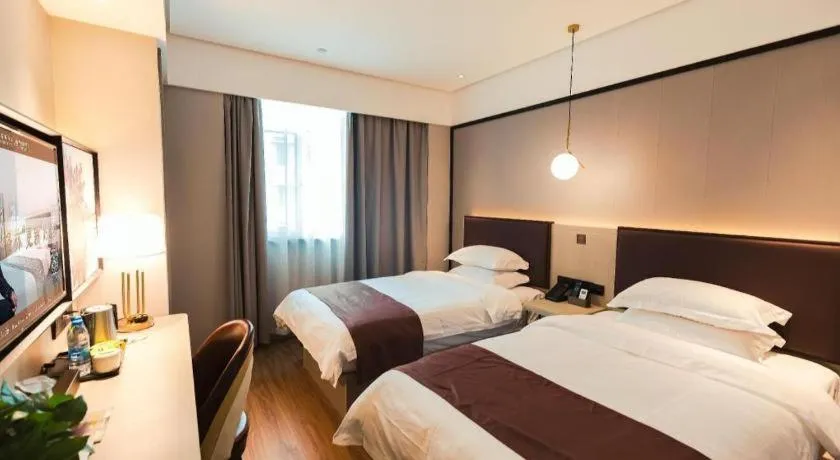 Bed in GYA Shanghai Jiangpu Hotel