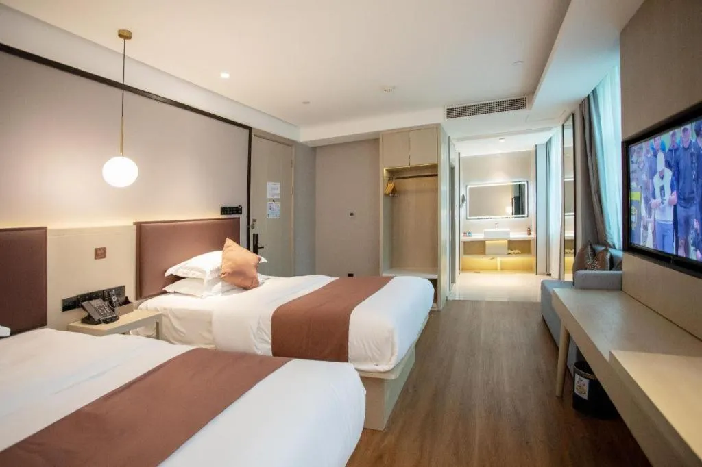 Bed in GYA Shanghai Jiangpu Hotel