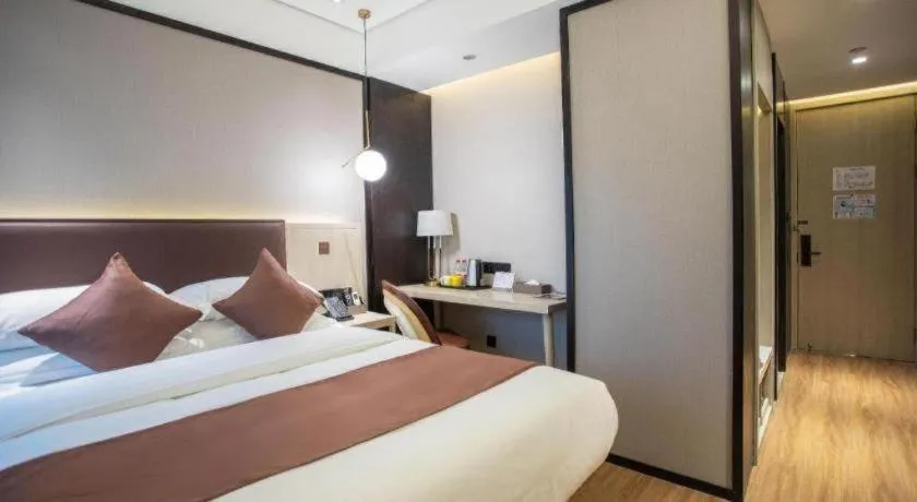 Bed in GYA Shanghai Jiangpu Hotel